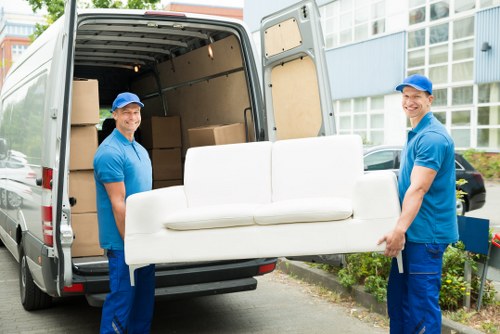 Man with van loading furniture in Battersea