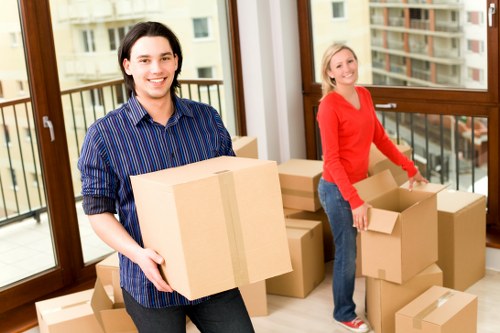 Local movers wrapping furniture and fragile items during a Battersea move